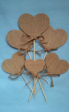 six heart shaped lollipop sticks tied together with twine and burlap