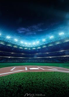 an empty baseball stadium with the lights on