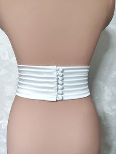 Width 3.5 inches (9cm) Fabric: Satin Duchess (shown in the photo) Color: light ivory (shown in the photo) Fabric belts: Italy mulberry silk\ Satin Duchess\ Matte satin\ Satin crepe Handmade buttons Other fabric options: 1. Mulberry silk 2. Matte satin 3. Satin Duchess 4. Satin crepe 5. Mikado The width of the belt/Number of buttons 0.6"=1.5cm/ 1 button 0.8"= 2cm/ 1 button 1"= 2.5cm/ 2 buttons 1.2"= 3cm/ 2 buttons 1.6"= 4cm/ 3 buttons 2"= 5 cm/ 4 buttons 3"=7.6cm/ 5 buttons 3.5"=9cm/ 6 buttons 4"= 10cm/ 7 buttons Strapless Wedding Corset Belt With Fitted Bodice, Elegant Strapless Corset Belt For Wedding, Elegant Fitted Corset Belt With Belt Loops, White Corset Belt For Party, White Strapless Corset Belt For Party, White Bridal Belt For Bride, Wedding Sashes With Satin Finish, Elegant Satin Corset Belt With Fitted Bodice, Elegant Satin Corset Belt