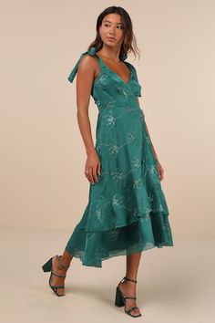 Head to the event knowing your look is bound to impress when you're wearing the Lulus Elegant Direction Green Embroidered Ruffled Tie-Strap Midi Dress! Lightweight woven fabric boasts a vintage-inspired pattern of floral embroidery as it shapes tying shoulder straps and a surplice bodice with princess seams. Fitted waist tops an overlapping skirt that has tiers of ruffled trim, ending at a midi hem. Hidden zipper/clasp at back. Fit: This garment fits true to size. Length: Mid-calf length. Size m Embroidered Midi Dress, Adhesive Bra, Half Skirt, Dresses Xxl, Princess Seams, Gowns Of Elegance, Reception Dress, Lulu Dresses, Large Size Dresses