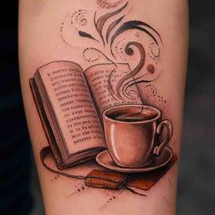 a cup of coffee and an open book tattoo on the right arm, with some writing coming out of it