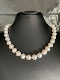 Freshwater Single Strand Bridal Pearl Necklace. This beautiful necklace is the epitome of class. One unique strand of hand strung and individually knotted pearls. The luster is very good. All of the pearls are beautifully matched for luster, color and overtone. 18 inch, with a sterling silver toggle clasp. Quality pearl necklaces are always knotted between the pearls. The necklace is double hand-knotted with silk thread. This protects the pearls from rubbing together and becoming damaged. All pe Cheap Vintage Single Strand Pearl Necklace, Elegant Adjustable Pearl Necklace With Sterling Silver Clasp, Elegant Hand-strung Pearl Necklace For Formal Occasions, Classic Round Hand-strung Jewelry, Single Strand Round Pearl Necklace Gift, Single Strand Pearl Necklace Gift, Single Strand Round Pearl Necklace As Gift, Pearl White Single Strand Pearl Necklace, Elegant Hand-strung Necklaces For Formal Occasions