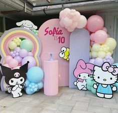 hello kitty themed birthday party with balloons and decorations