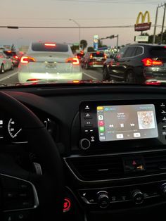 the dashboard of a car on a busy highway with cars driving down it's lane