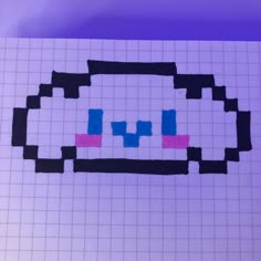 a piece of paper that has been made to look like a computer game console with blue and pink squares on it