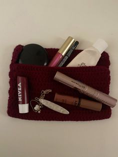 the contents of a makeup bag are neatly organized and ready to be carried out for use