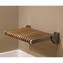 a towel rack mounted to the side of a wall