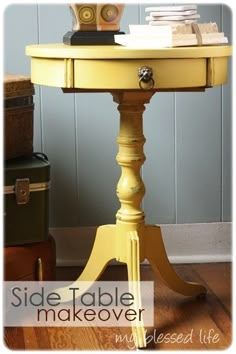 a yellow table with some books on it and a suitcase in the corner next to it