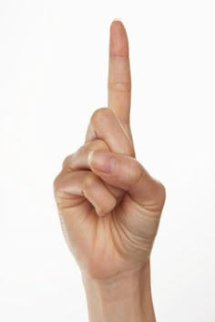 a person is making the middle finger sign with their index and hand, on a white background