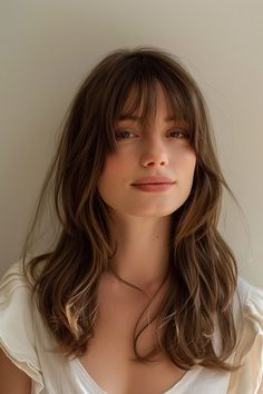 From the pretty long brown hair with long bangs you see here to side-swept styles and tousled curtain bangs, there are a ton of ways to rock the sexy bangs aesthetic. Click through for 40+ hottest haircuts with bangs and follow us for more hairstyles and hair color inspo! Layers Hair With Fringe, Wispy Bangs With Face Framing Layers Wavy Hair, Bangs Center Part, Bangs W Long Hair, Haircuts For Beach Wave Hair, Casual Bangs Hair, Brown Haircut With Bangs, Brown Fringe Hair, French Wispy Fringe