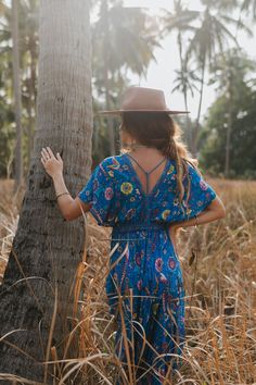 Product Details: Beautiful dress in floral/Bird print Features Kimono style short sleeves Deep v-neck front and back Back neckline has hanging tassel tie Drawstring high waist with hanging tassel ties Cropped maxi / midi length depending on height Fabric: Rayon Hippie Blue V-neck Dress, Blue Short Sleeve Festival Dress, Blue Hippie V-neck Dress, Hippie Style Blue V-neck Dress, Blue V-neck Dress For Festival, Blue V-neck Festival Dress, Kimono Style, Bird Print, Maxi Dress Blue