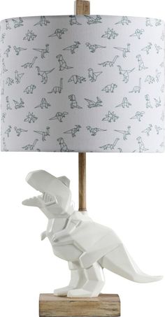 a lamp with a dinosaur design on it