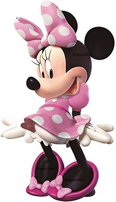 a minnie mouse figurine with polka dots on it's head and legs