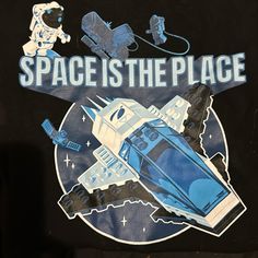 the space is the place t - shirt has an image of a car and astronaut on it