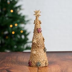 a wicker christmas tree on a wooden table