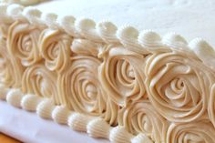 a close up view of a cake with white frosting