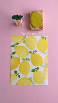 a piece of paper with lemons on it next to a rubber stamp that says it's fugefrit