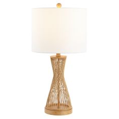 a table lamp with a white shade on the base and a wooden frame around it