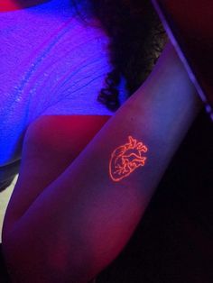 a person with a tattoo on their arm