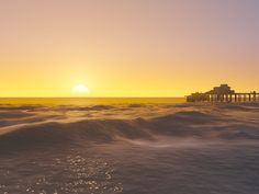 the sun is setting over an ocean with waves in front of it and a pier