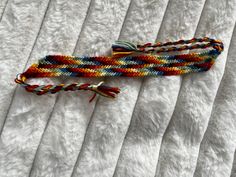 Rainbow stripe bracelet. Many beautiful colors and handmade to fit any wrist. Adjustable Multicolor Wristband Bracelet, Multicolor Friendship Wristband, Multicolor Braided Bangle Bracelets For Friendship, Multicolor Bangle Wrap Bracelet For Friendship, Multicolor Friendship Bracelets As Gift, Multicolor Braided Jubilee Friendship Bracelets, Handmade Multicolor Friendship Wristband, Multicolor Jubilee Friendship Bracelets, Adjustable Multicolor Band Bracelets