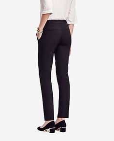 Elevate your wardrobe with the Ann Taylor Petite Ankle Pant in Seasonless Stretch, a staple that combines timeless style with modern tailoring. Perfect for any season, these pants are designed to flatter with a slim leg that gracefully crops at the ankle.

- Size: Petite 2
- Color: Black
- Material: 48% Polyester, 48% Viscose, 4% Spandex
- Gender: Female
- Fit: Regular fit, lean through the hip and thigh
- Rise: Mid rise, sits 2 1/4" below natural waist
- Length: Hits at ankle, 26" inseam with 1 Dress Pants Casual, Stylish Pants Women, Lean Legs, Ann Taylor Petite, Slacks For Women, Knitted Suit, Slim Leg, Chic Woman, Ankle Pants