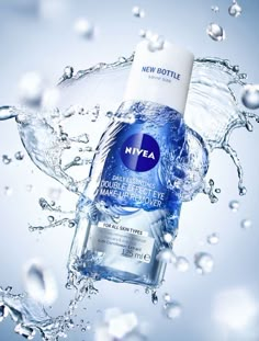 a bottle of nivea water is floating in the air with bubbles around it