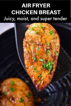 the chicken breast is being held up by a spatula