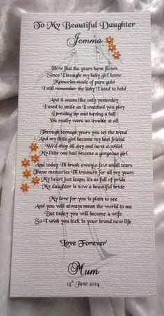 the poem for my beautiful daughter is displayed on a white sheet with an orange flower