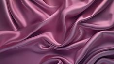 a close up view of a purple satin fabric with very high resolution and soft folds