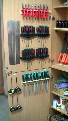 there are many tools hanging on the wall