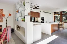 the kitchen is clean and ready to be used as a living room or dining area