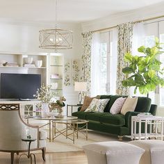 a living room filled with furniture and a flat screen tv