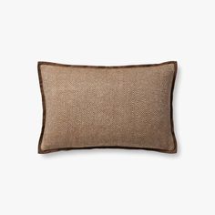 a brown pillow on a white background