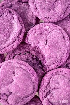 purple cookies are piled on top of each other