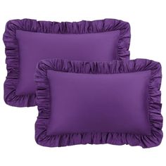 three purple pillows with ruffled edges