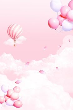 pink and white balloons floating in the sky