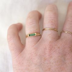 A slim rounded gold band with a signet like face made of a beautiful tourmaline bar - a sleek and modern way to add a pop of color to your stack! Details: Solid 14k Green Tourmaline baguette (8mm x 2mm) Long Rings Gold, Long Rings, Long Ring, Bar Ring, Rings Gold, Green Tourmaline, Gold Band, Gold Bands, Tourmaline