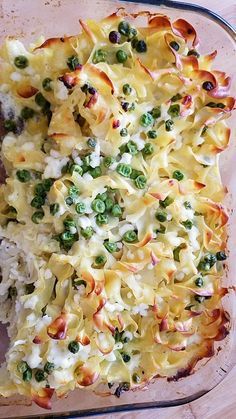 a casserole dish with peas and cheese