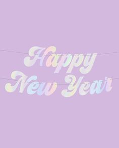 the words happy new year are painted in pastel colors on a light purple background