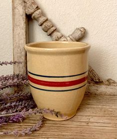 a vase sitting on top of a wooden table