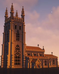 a very large building with a clock on it's side in the evening sun