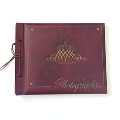 a red book with writing on the front and back cover that says photography in gold lettering