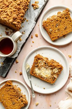 three plates with slices of cake on them next to a cup of tea and fork