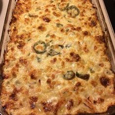 a casserole dish with cheese and green peppers on it, ready to be eaten