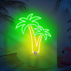 a neon palm tree is lit up in the dark