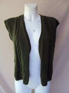 Handmade olive green knitted vest size 12, bust 92cm/36", waist 73cm/29", hip 98cm/38.5". Such a sweet little boho handmade olive green knitted vest. Olive green vest, vintage green vest, green vest, boho green vest, retro green vest, hippie green vest Green V-neck Vest For Winter, Green Knit Vest For Fall, Green Knitted Winter Vest, Green Knitted Sleeveless Sweater Vest, Green Knit Sleeveless Vest, Green Sleeveless Knit Vest, Fitted Green Sweater Vest For Fall, Fitted Green V-neck Vest, Vintage Green Vest For Fall