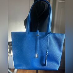 A Nice Tote Bag That Can Be Used For Work Or Everyday Use. Blue Top Handle Bag For Office, Blue Rectangular Shoulder Bag For Office, Blue Rectangular Office Bag, Rectangular Blue Office Bag, Modern Blue Pouch Shoulder Bag, Modern Blue Top Handle Bag, Blue Pouch Bag For On-the-go, Blue Bags With Handles For Daily Use, Blue Large Capacity Shoulder Bag For Office