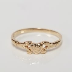 Thanks for shopping our vintage estate store. We tend to sell well below wholesale and truly hope you enjoy all of our items. Many of the items are one of a kind, so please enjoy scrolling through the pictures and hopefully something will catch your eye. Brown spots are from camera or reflections. Estate 14k yellow gold heart baby ring. Custom made ring for our shop. Ring size: 1.5 sizing fee $10 Setting: 3mm Band width: 1mm Weight: .43 gram Marked 14k and it's sweet. One that you will love. Only Gold Ring, Gold Ring Heart, Vintage Gold Ring, Antique Gold Rings, Baby Ring, Baby Heart, Heart Rings, Antique Style Rings, Vintage Gold Rings