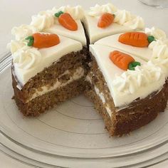 a carrot cake with white frosting on a plate